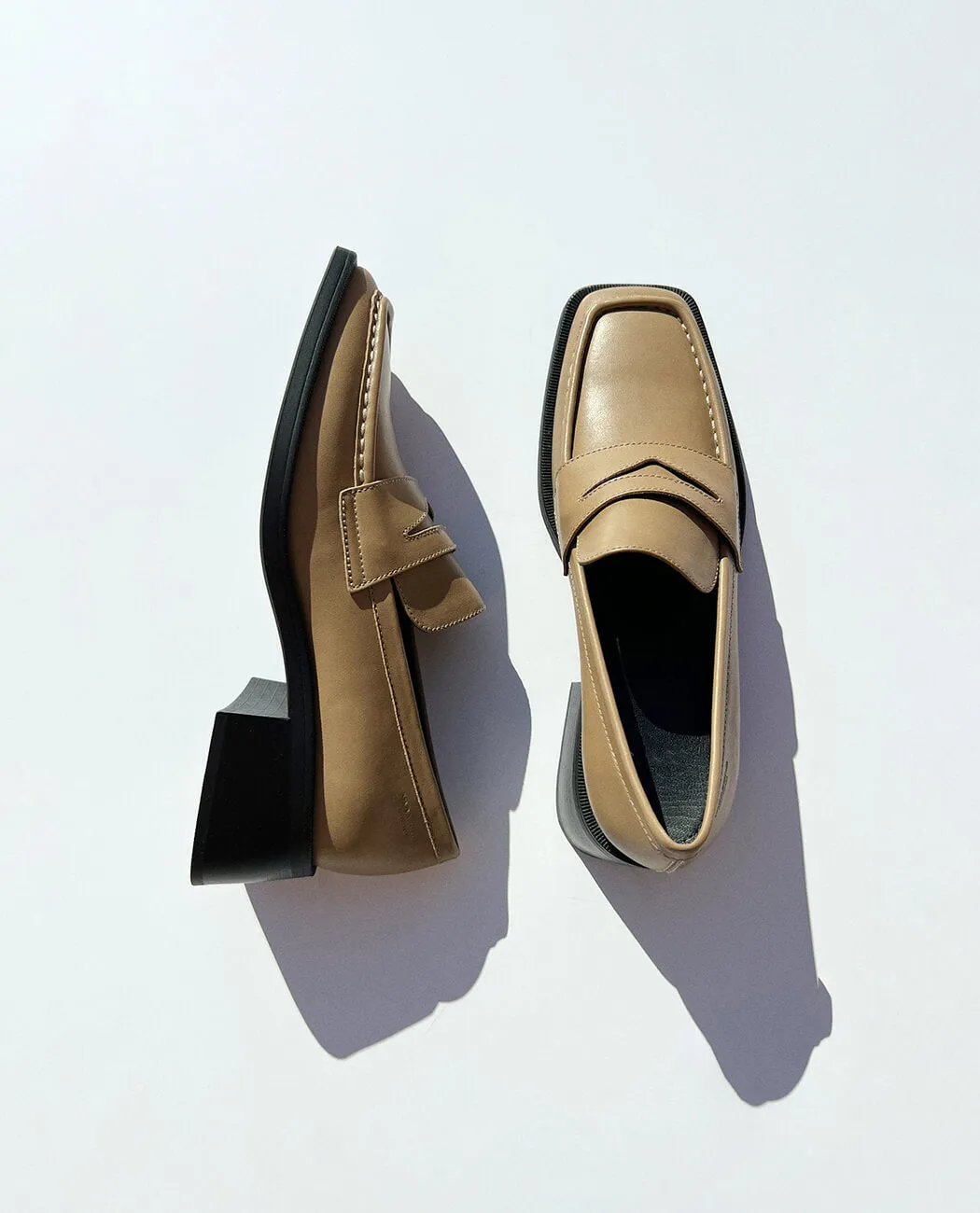 Modern heeled black loafer for men