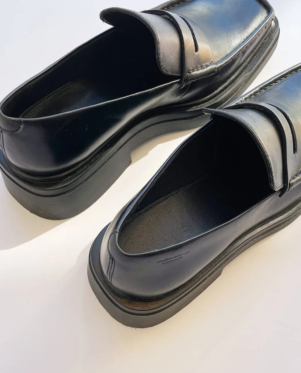Modern heeled black loafer for men
