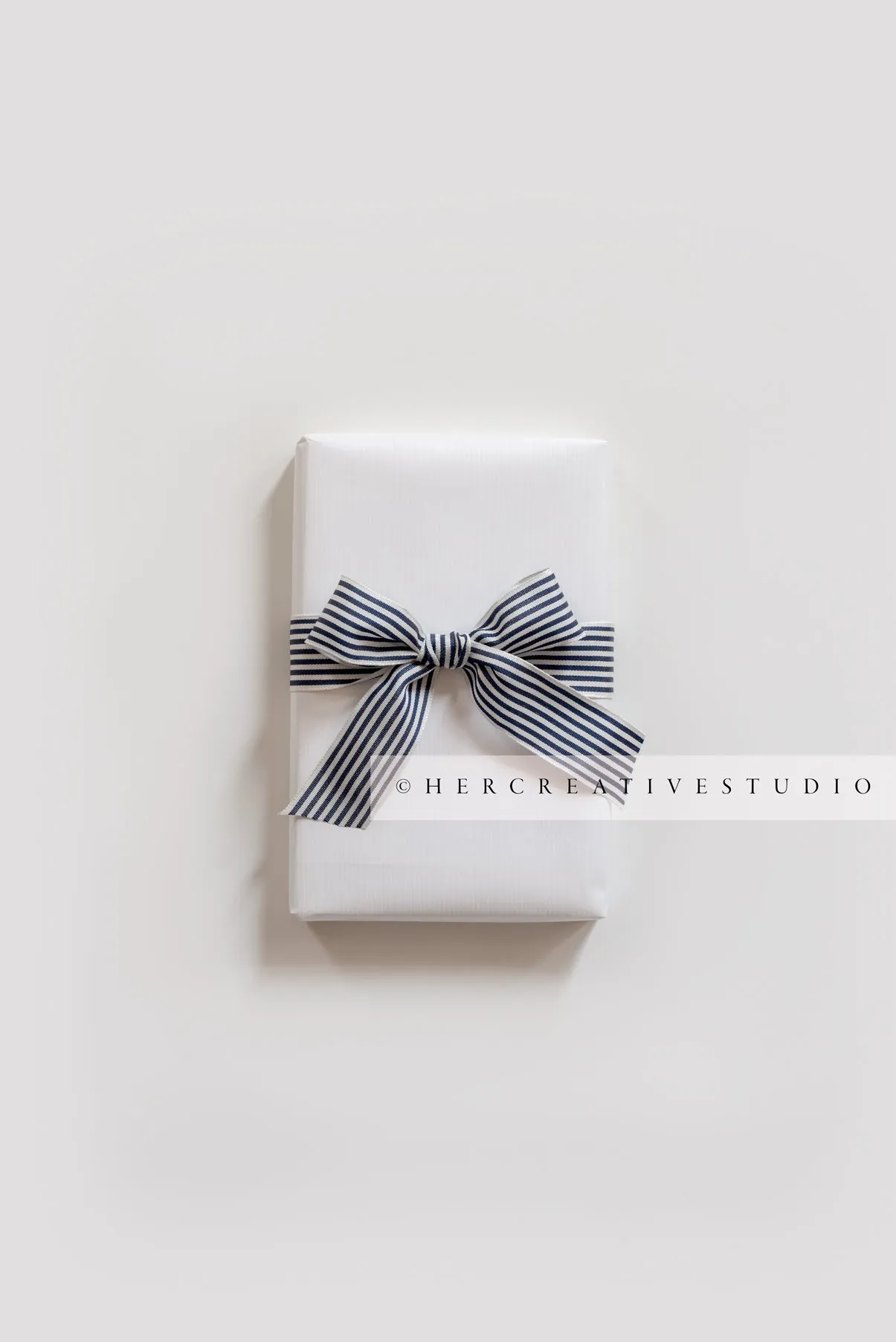 White Gift with Striped Ribbon, Stock Image